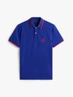 Polo-corte-regular-con-escudo-bordado-de-hombre-Tommy-Hilfiger-MW0MW40428-D03